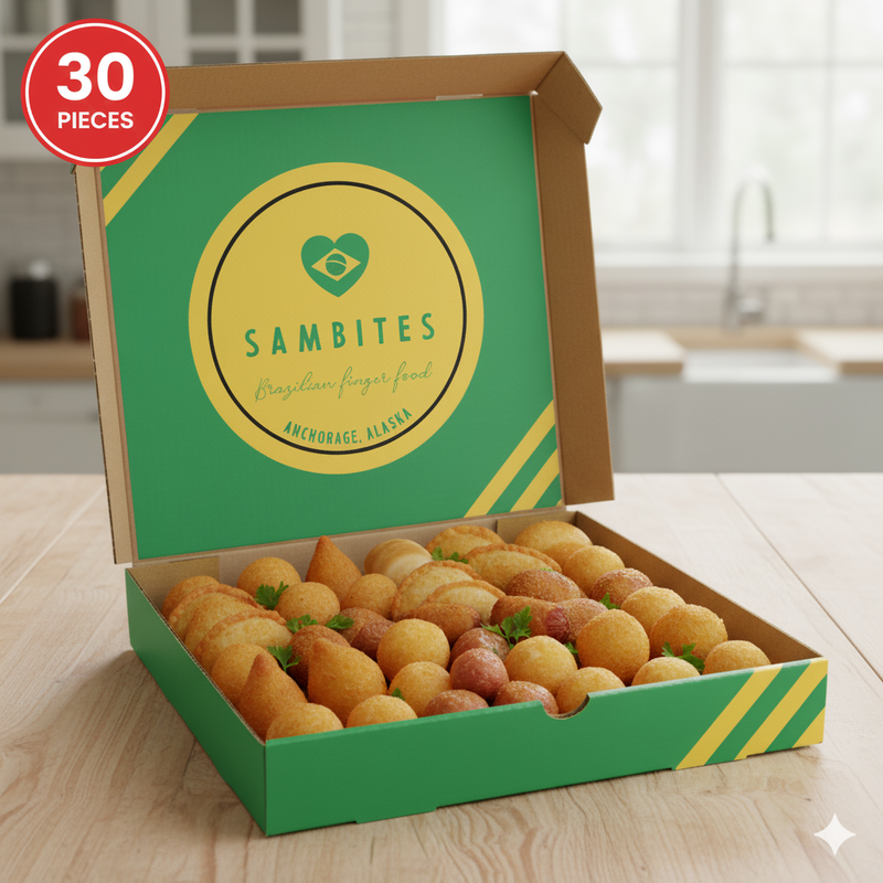 Box of Sambites Brazilian finger food with a green and yellow design on a wooden table.